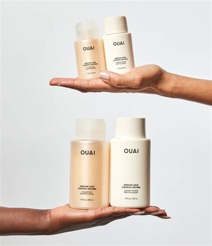 A bottle of OUAI thick hair conditioner for curly hair