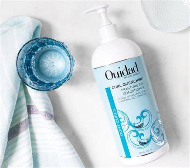 A bottle of ouidad curl shaper cleansing conditioner for curly hair