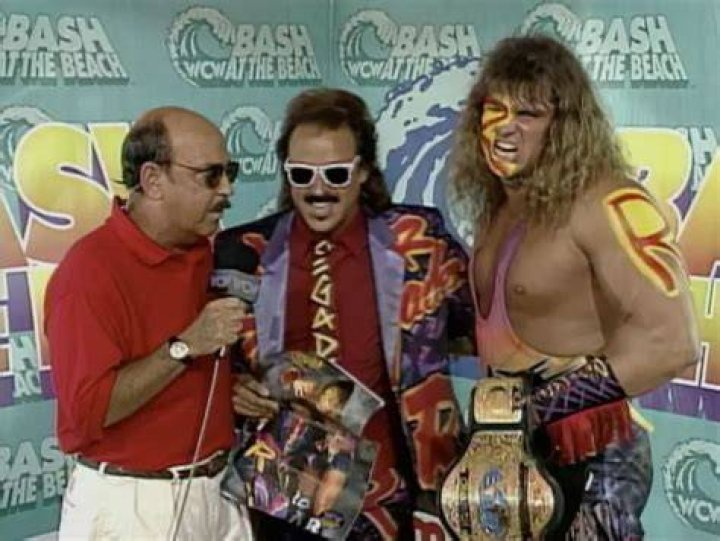 Jimmy Hart with The Renegade and Mean Gene Okerlund in WCW