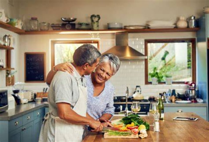 Older couple cooking together