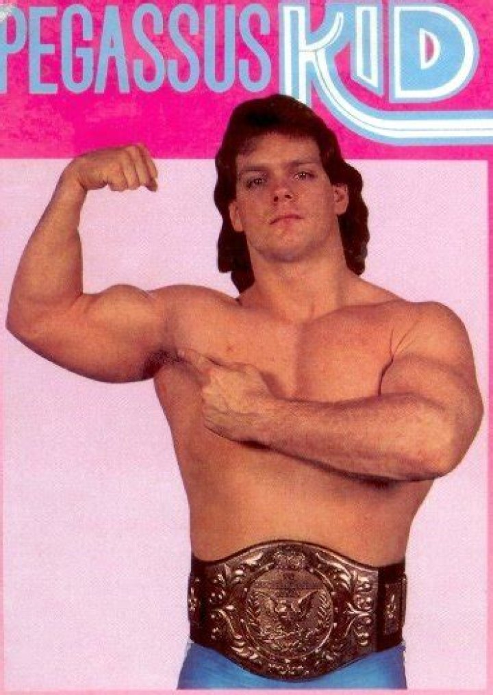 Pegasus Kid with the WWE Light Heavyweight Championship