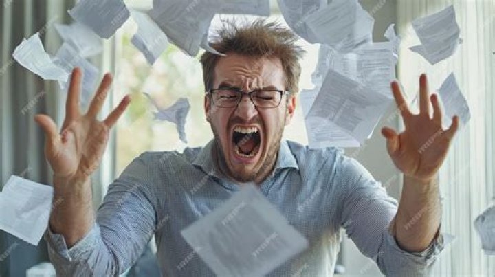 person throwing loose papers into the air
