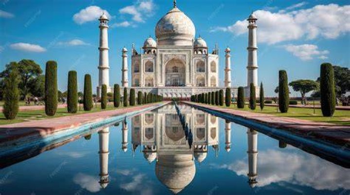 reflection of the Taj Mahal in the women's glasses