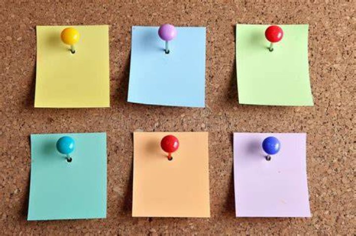 sticky notes pinned to board with vocab
